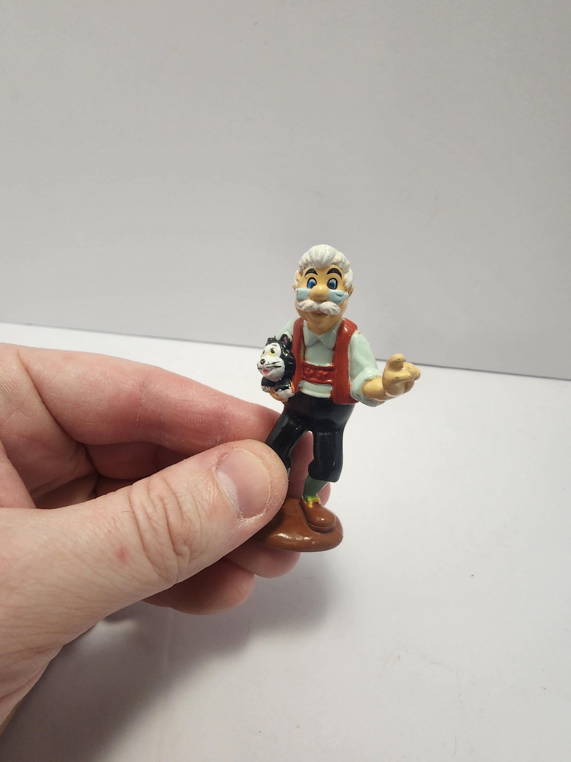 Geppetto Holding Figaro From Disney's Pinocchio - Pinocchio - Pinocchio Toys - Disney - Disney Toys - Geppetto - Figaro - Disney Gifts